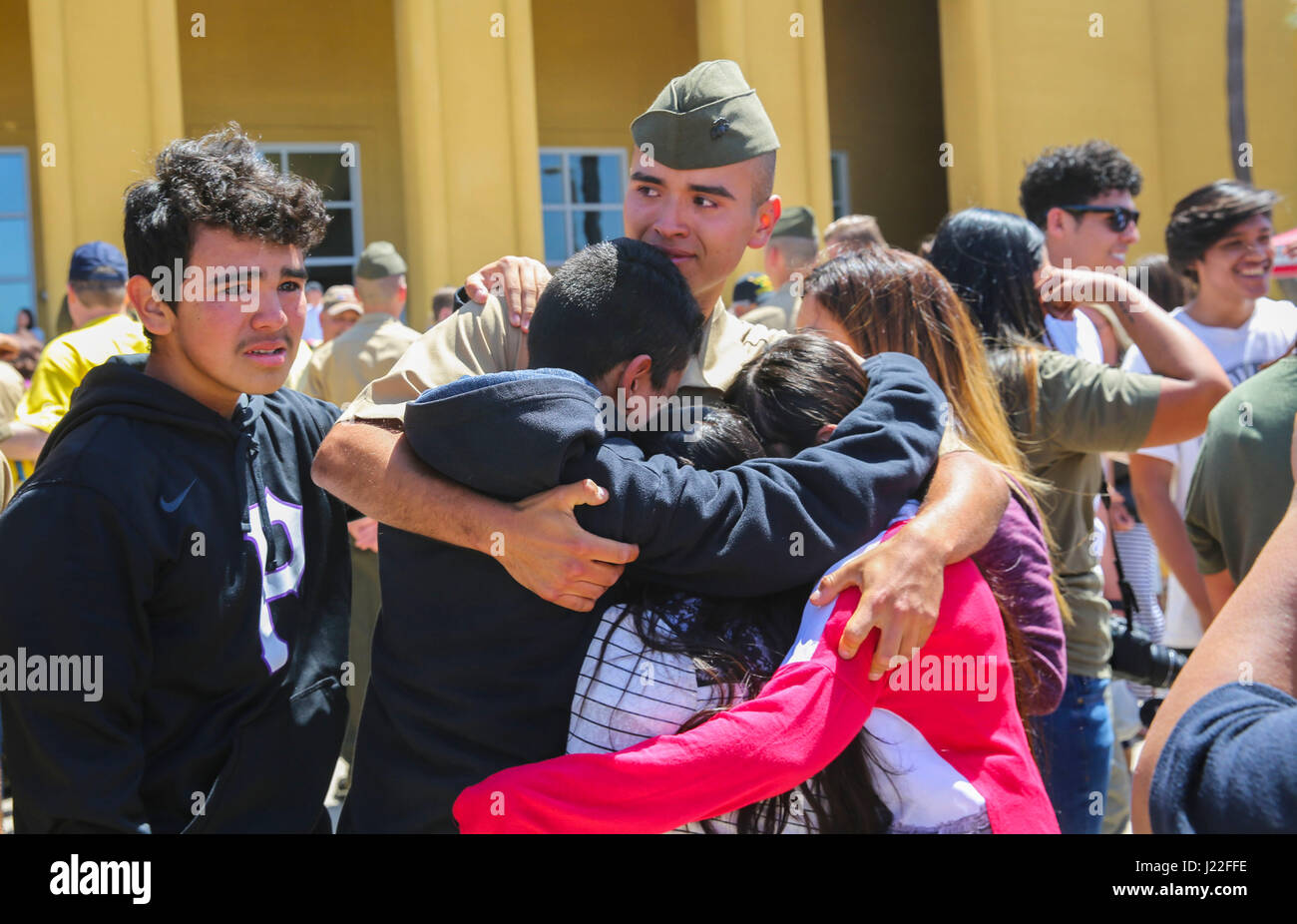 The new Marines of Golf Company, 2nd Recruit Training Battalion, embrace their loved ones during liberty call at Marine Corps Recruit Depot San Diego, today.  After nearly thirteen weeks of training, the Marines of Golf Company will officially graduate from recruit training tomorrow. Stock Photo