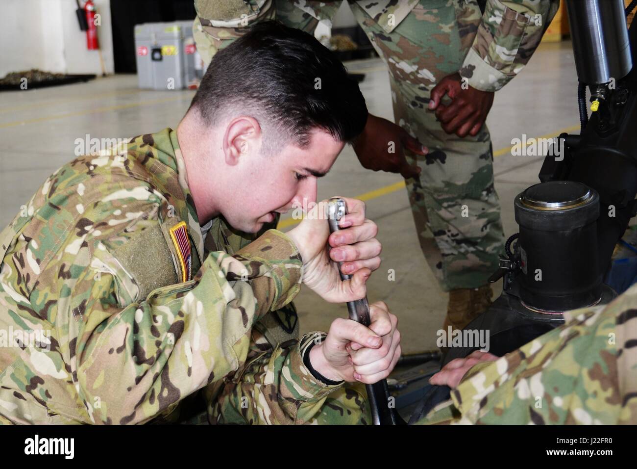 Soldiers from the 10th Combat Aviation Brigade perform routine UH-60 ...