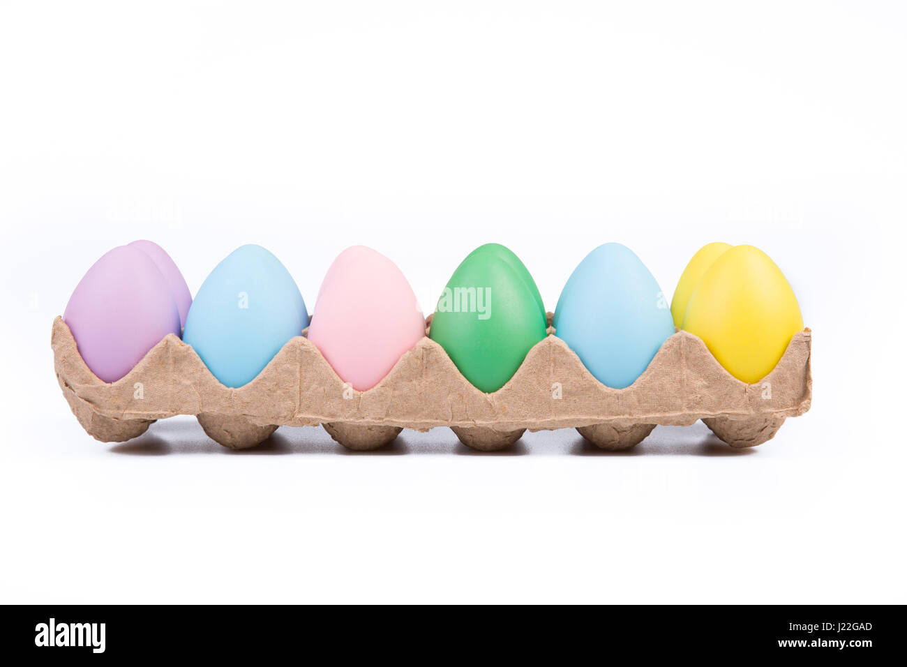 One dozen colored Easter eggs in a crate Stock Photo - Alamy