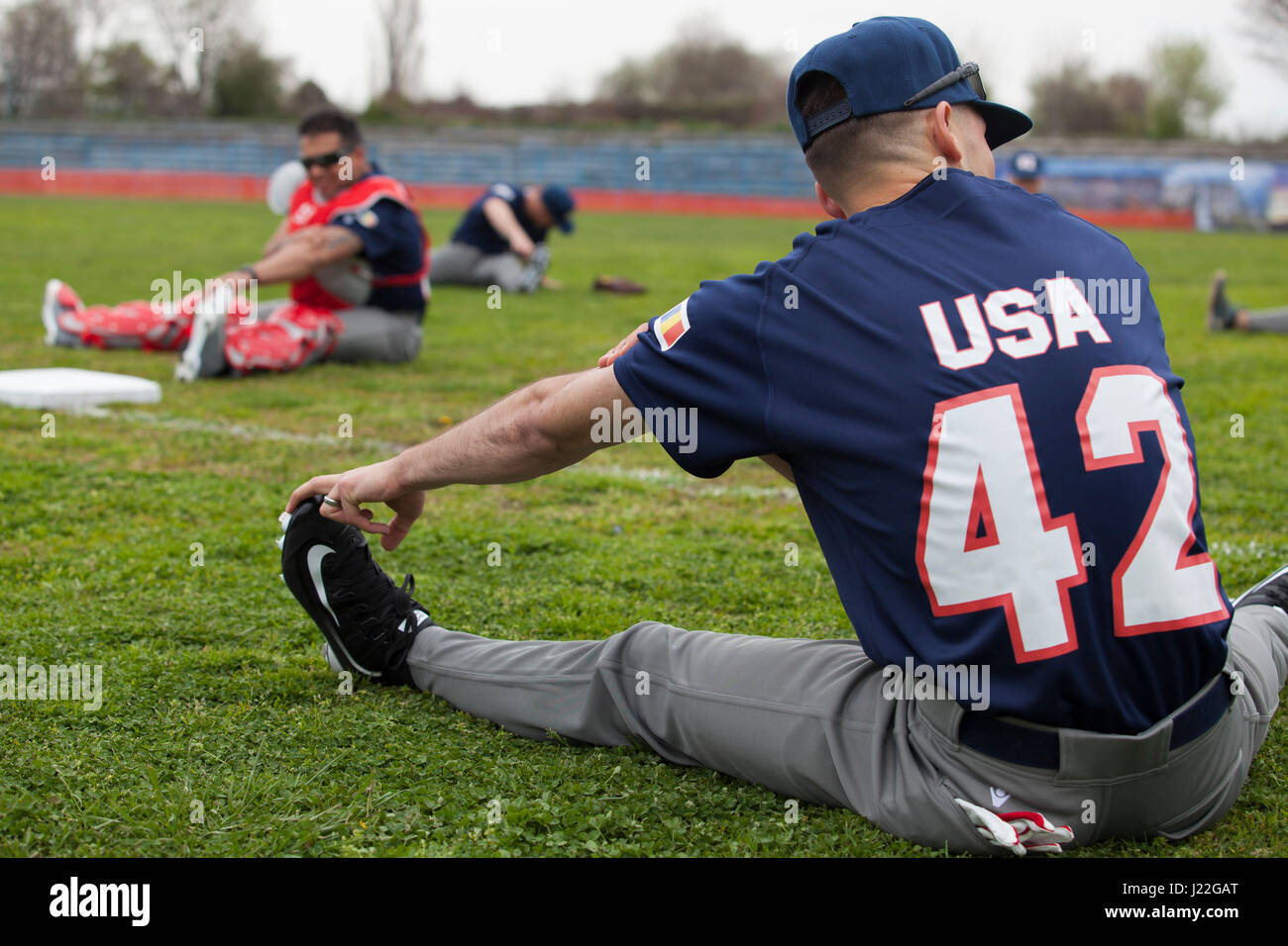U.S. Marines with the Black Sea Rotational Force 17.1 stretch before the Jackie Robinson Day baseball game between the U.S. Marines and a Romanian team in Constanta, Romania April 15, 2017. The Marine and Romanian players all wore the number 42 jersey in honor of the 70th anniversary of Robinson becoming the first African American player in the Major League Baseball history. (U.S. Marine Corps photo by Cpl. Emily Dorumsgaard) Stock Photo
