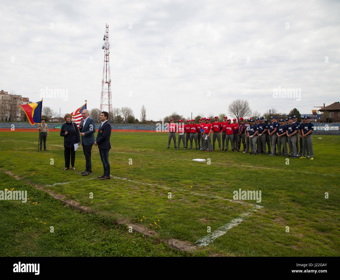 The Ambassador of the United States to Romania, Hans G. Klemm (middle) and the mayor of Constanta, Decebal Fagadau (right) address spectators and U.S. Marines with Black Sea Rotational Force 17.1 at the Jackie Robinson Day baseball game between the U.S. Marines and a Romanian team in Constanta, Romania, April 15, 2017. The Marine and Romanian players all wore the number 42 jersey in honor of the 70th anniversary of Robinson becoming the first African American player in the Major League Baseball history. (U.S. Marine Corps photo by Cpl. Emily Dorumsgaard) Stock Photo