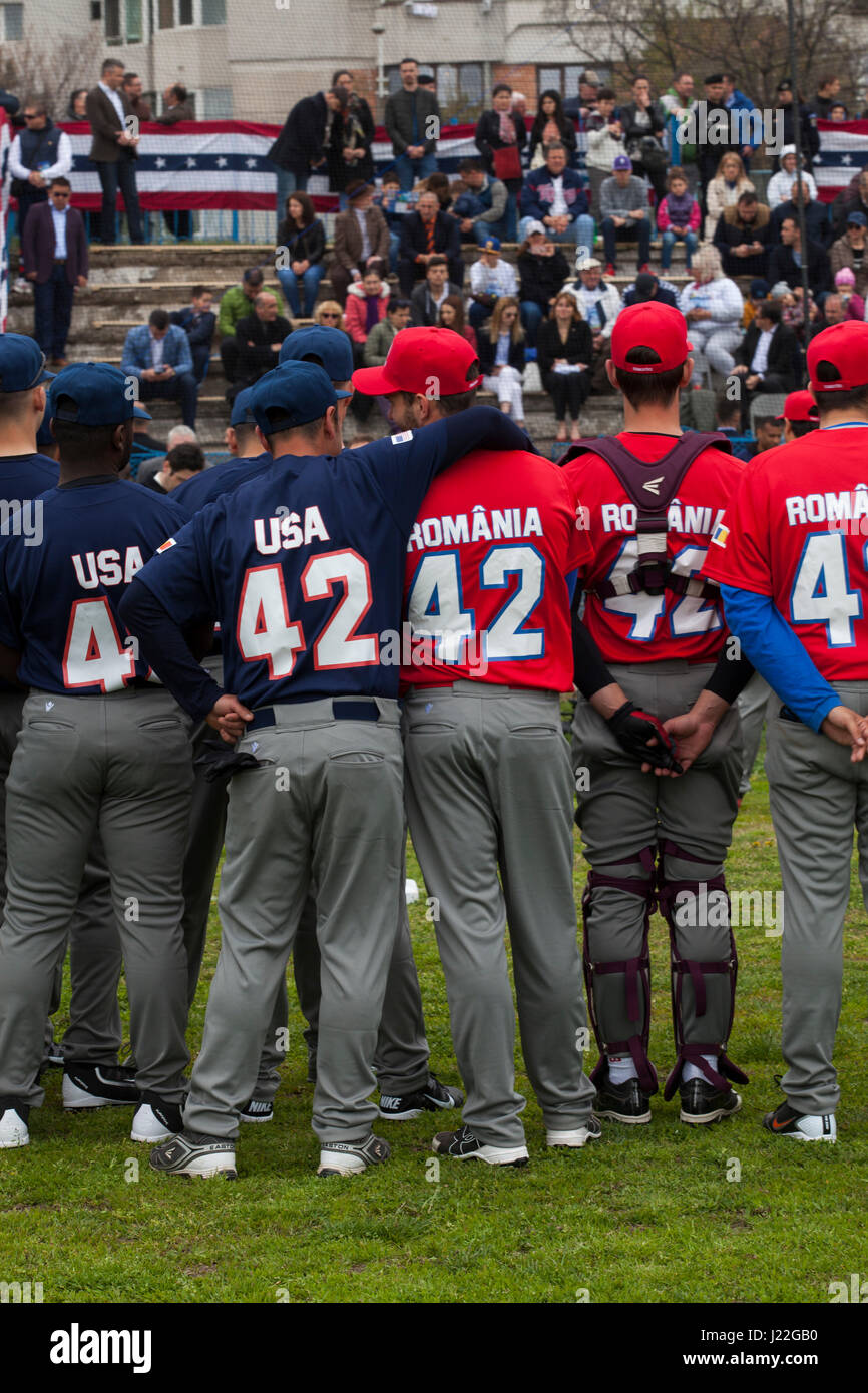 U.S. Marines with the Black Sea Rotational Force 17.1 stand with a Romanian baseball team before the Jackie Robinson Day baseball game in Constanta, Romania, April 15, 2017. The Marines and the Romanian players all wore the number 42 jersey in honor of the 70th anniversary of Robinson becoming the first African American player in the Major League Baseball history. (U.S. Marine Corps photo by Cpl. Emily Dorumsgaard) Stock Photo