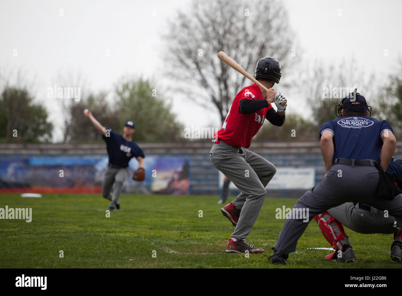 A U.S. Marine with the Black Sea Rotational Force 17.1 throws a pitch to a Romanian player at the Jackie Robinson Day baseball game between the U.S. Marines and a Romanian team in Constanta, Romania, April 15, 2017. The Marine and Romanian players all wore the number 42 jersey in honor of the 70th anniversary of Robinson becoming the first African American player in the Major League Baseball history. (U.S. Marine Corps photo by Cpl. Emily Dorumsgaard) Stock Photo