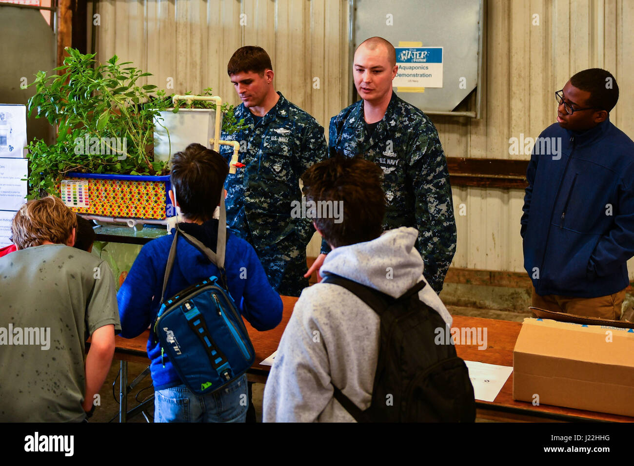 170418-N-SH284-011 BREMERTON, Wash. (April 18, 2017) Hospital Corpsman 1st Class John LaPage (left), Hospital Corpsman 1st Class Nick Behel (center) and Hospitalman Roy Wells, assigned to Naval Hospital Bremerton, teach third and fourth grade students from Kitsap County schools about the water cycle at the Kitsap Water Festival, held at the Kitsap County Fairgrounds. The Kitsap Water Festival is a day of learning about and celebrating water. Education experts, environmental professionals, storytellers, entertainers and members of the community set up presentations and exhibits. (U.S. Navy phot Stock Photo