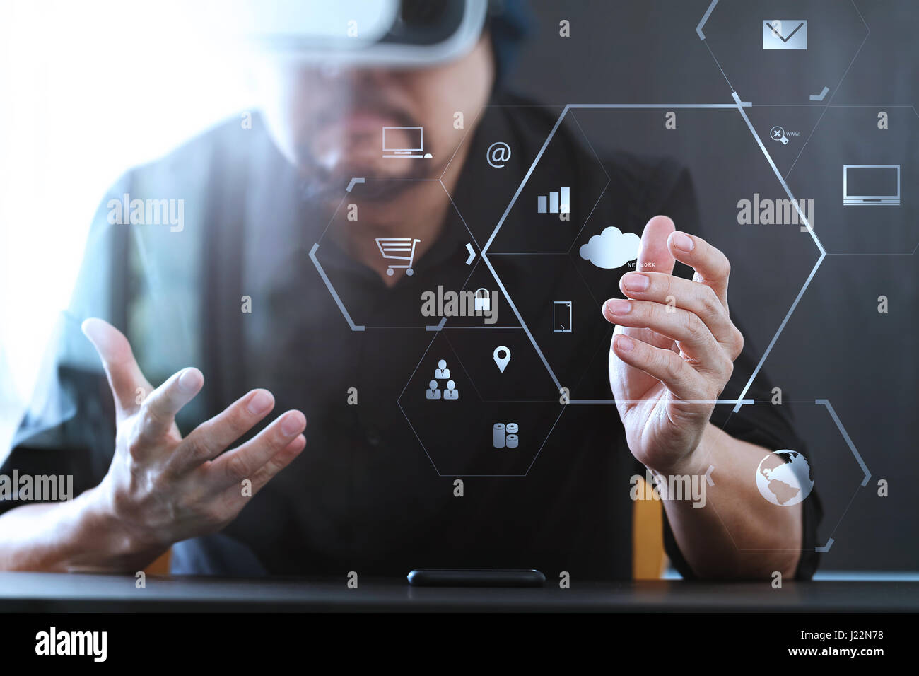 businessman wearing virtual reality goggles in modern office with ...