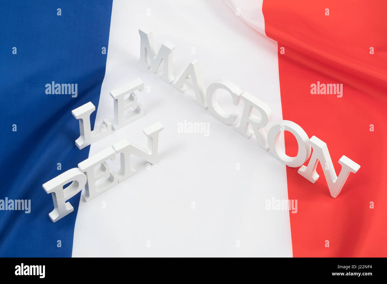 French tricolor flag and names of Le Pen & Macron  - as visual metaphor for the 2017 French General Election Stock Photo