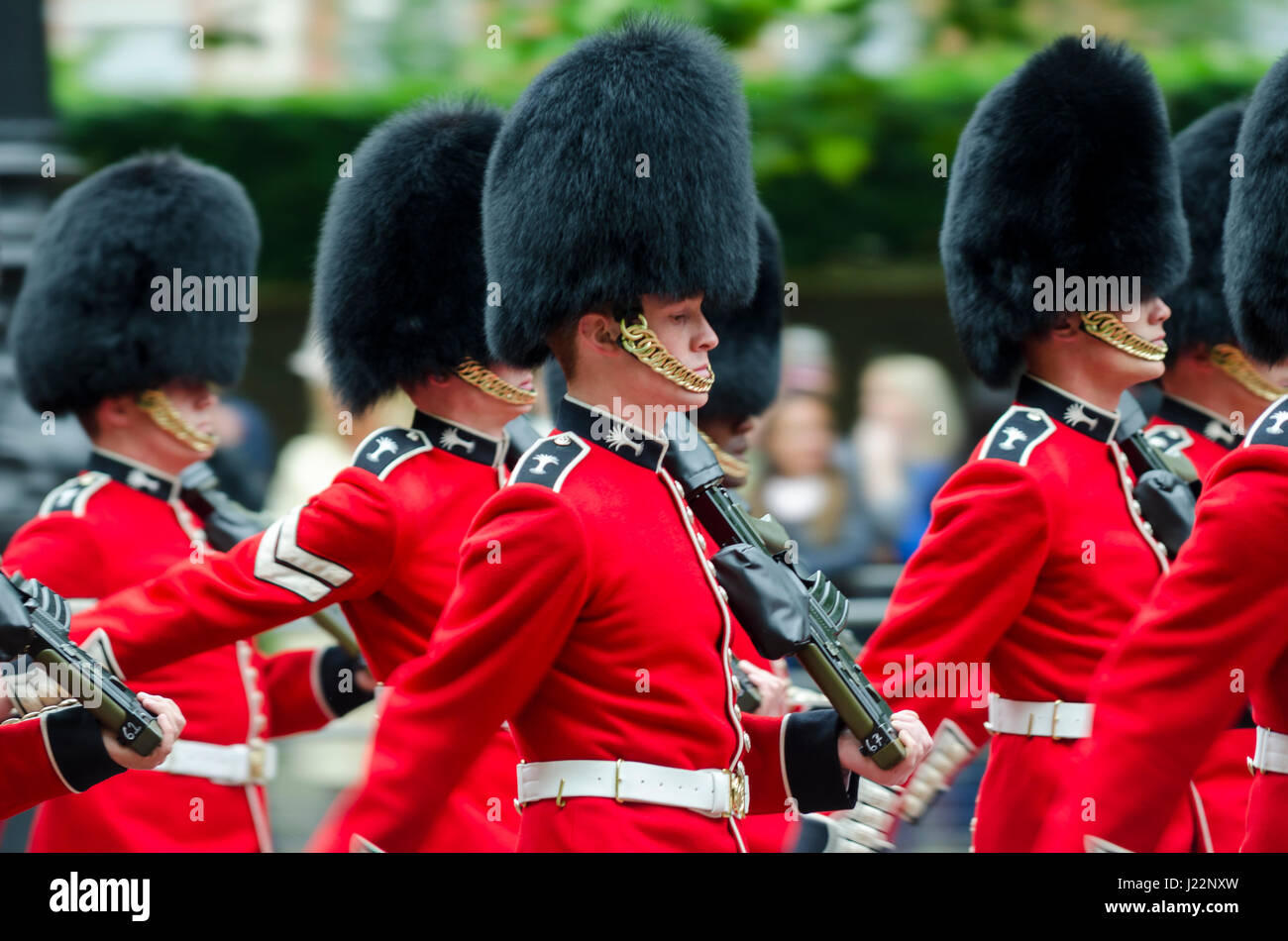 LONDON - JUNE 13, 2015: Members of the Queen's Royal Guard march on The Mall in a ceremony for Her Majesty's birthday celebration. Stock Photo
