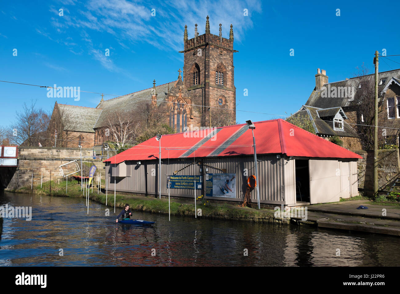 A canoeist on the Union Canal, beside the Forth Canoe Club boathouse