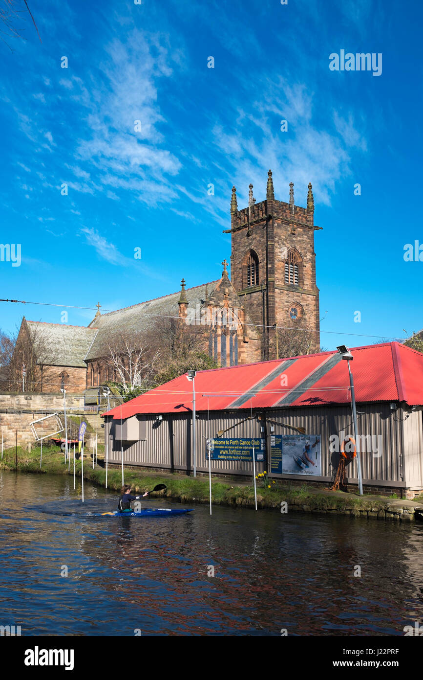 A canoeist on the Union Canal, beside the Forth Canoe Club boathouse