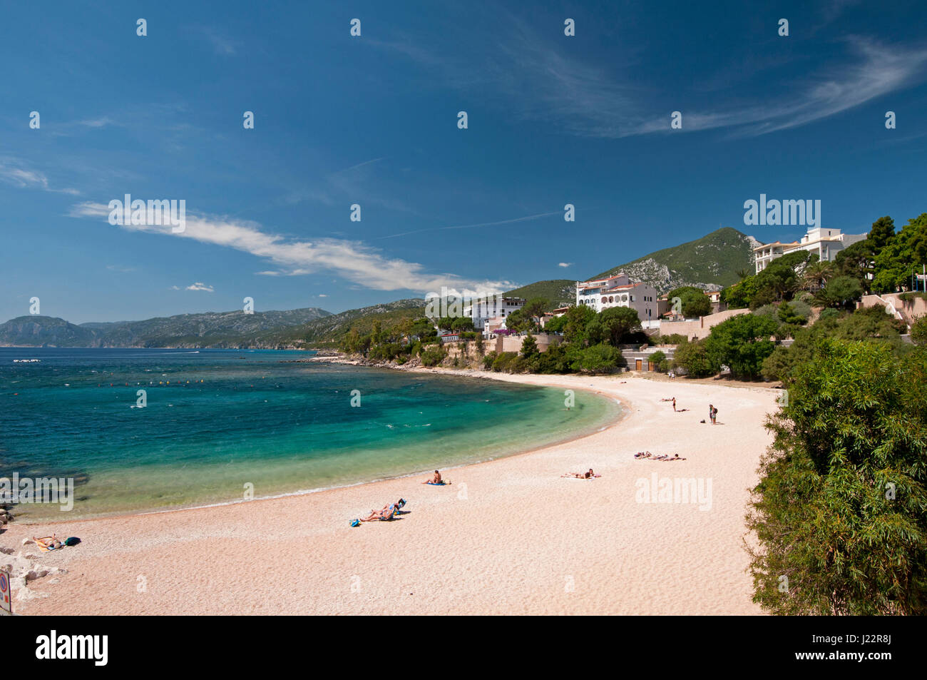 Tourist enjoy the sun at the Centrale beach, Cala Gonone, Sardinia, Italy Stock Photo