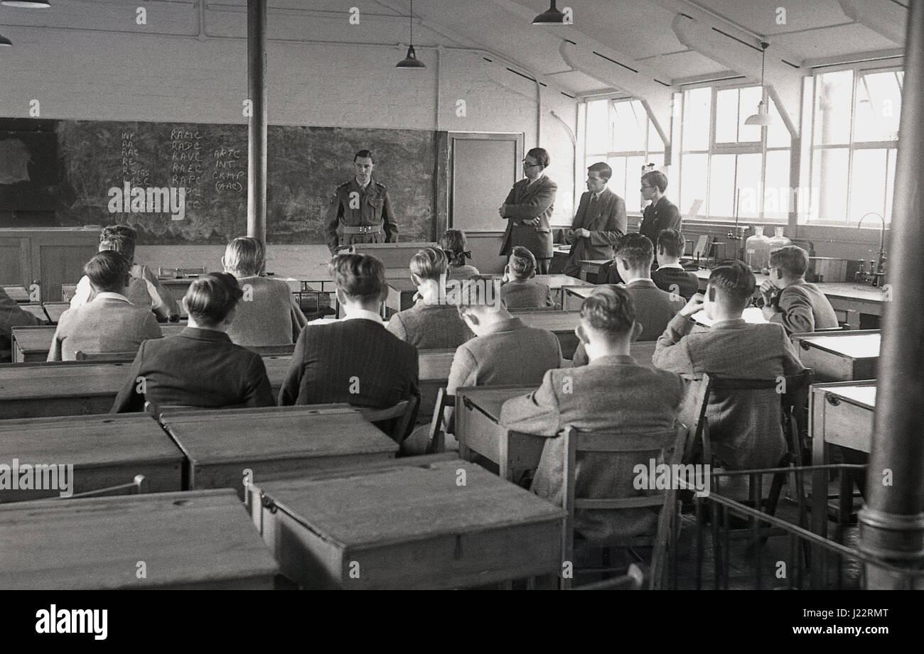 1950, group of young Brtish males in a classroom being spoken to by an army officer about conscription or national service in the armed forces which they had to serve between ages of 17 and 21. Stock Photo