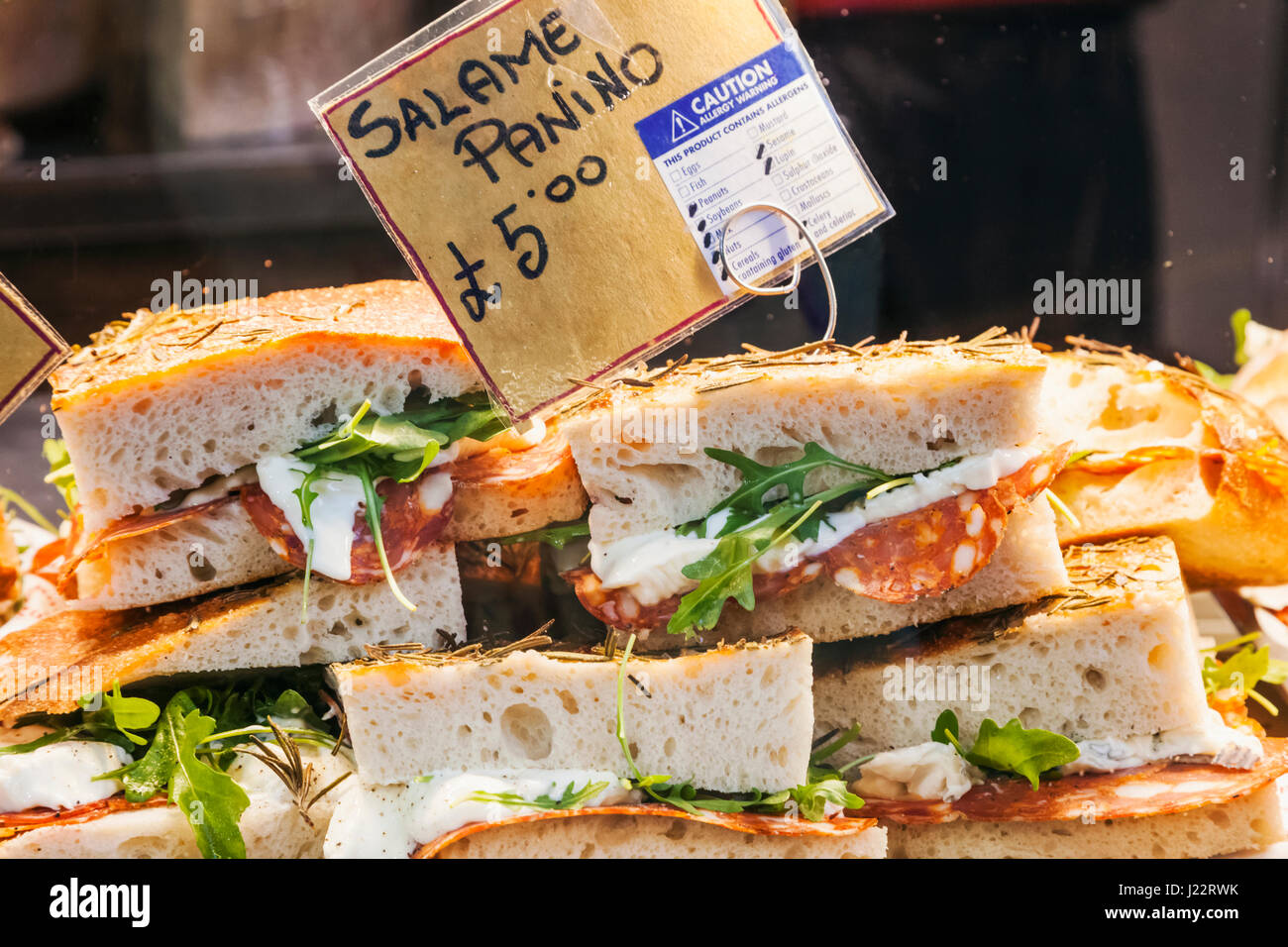 England, London, Southwark, Borough Market, Food Stall Display of Salami Panino Sandwiches Stock Photo