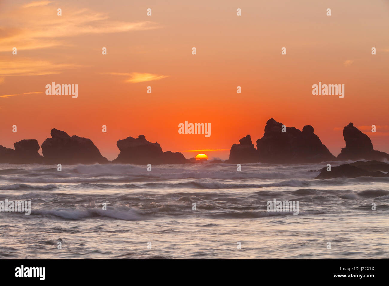 Sunset over sea stacks at Bandon Beach along the Oregon coast, Oregon, USA. Stock Photo