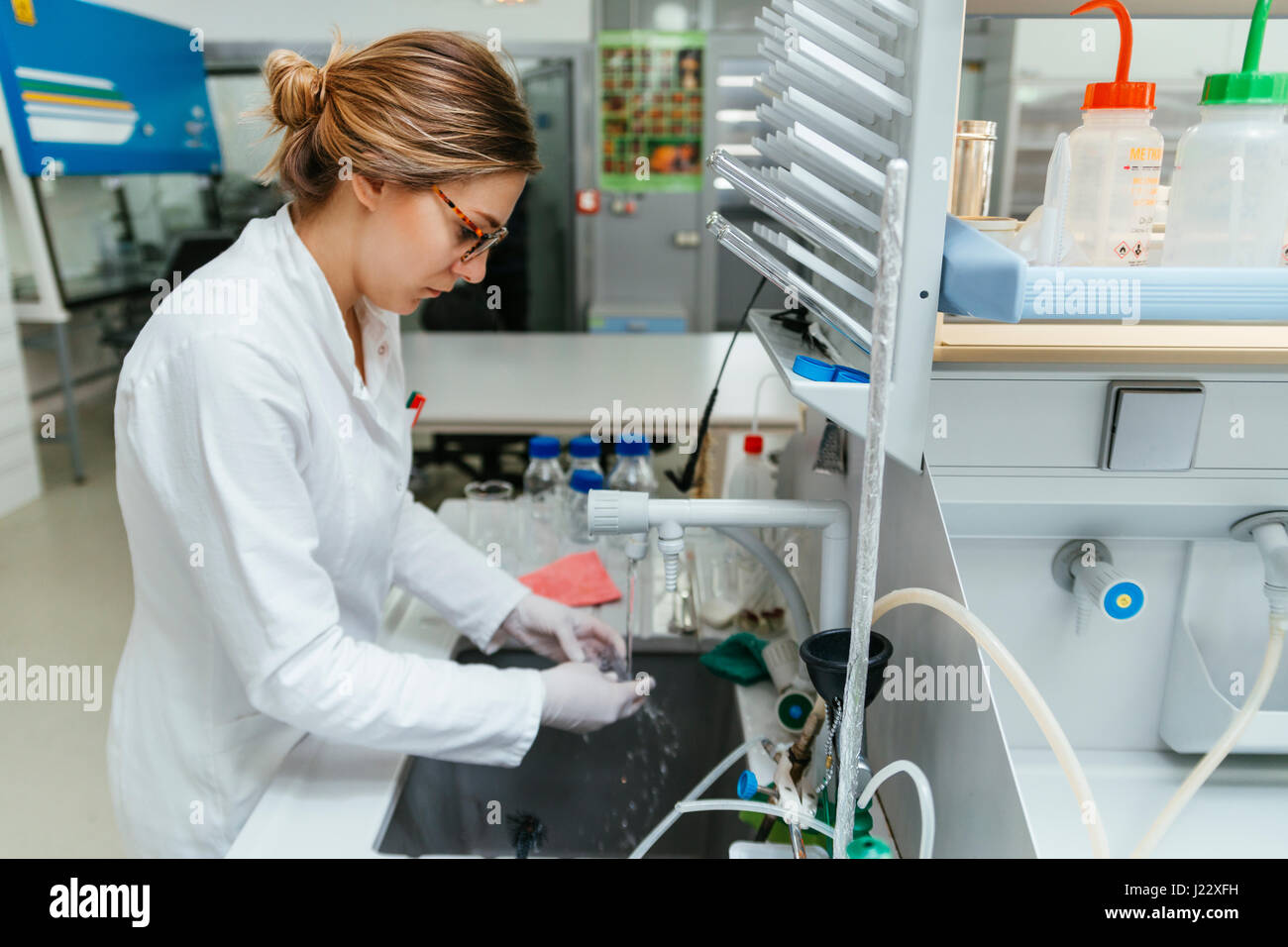 Laboratory technician in lab cleaning object Stock Photo Alamy