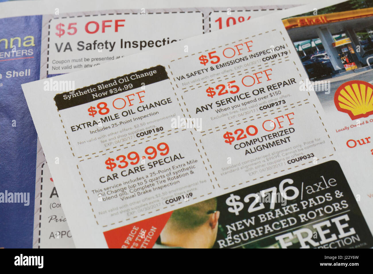 Car maintenance service coupons in weekly mailer - USA Stock Photo