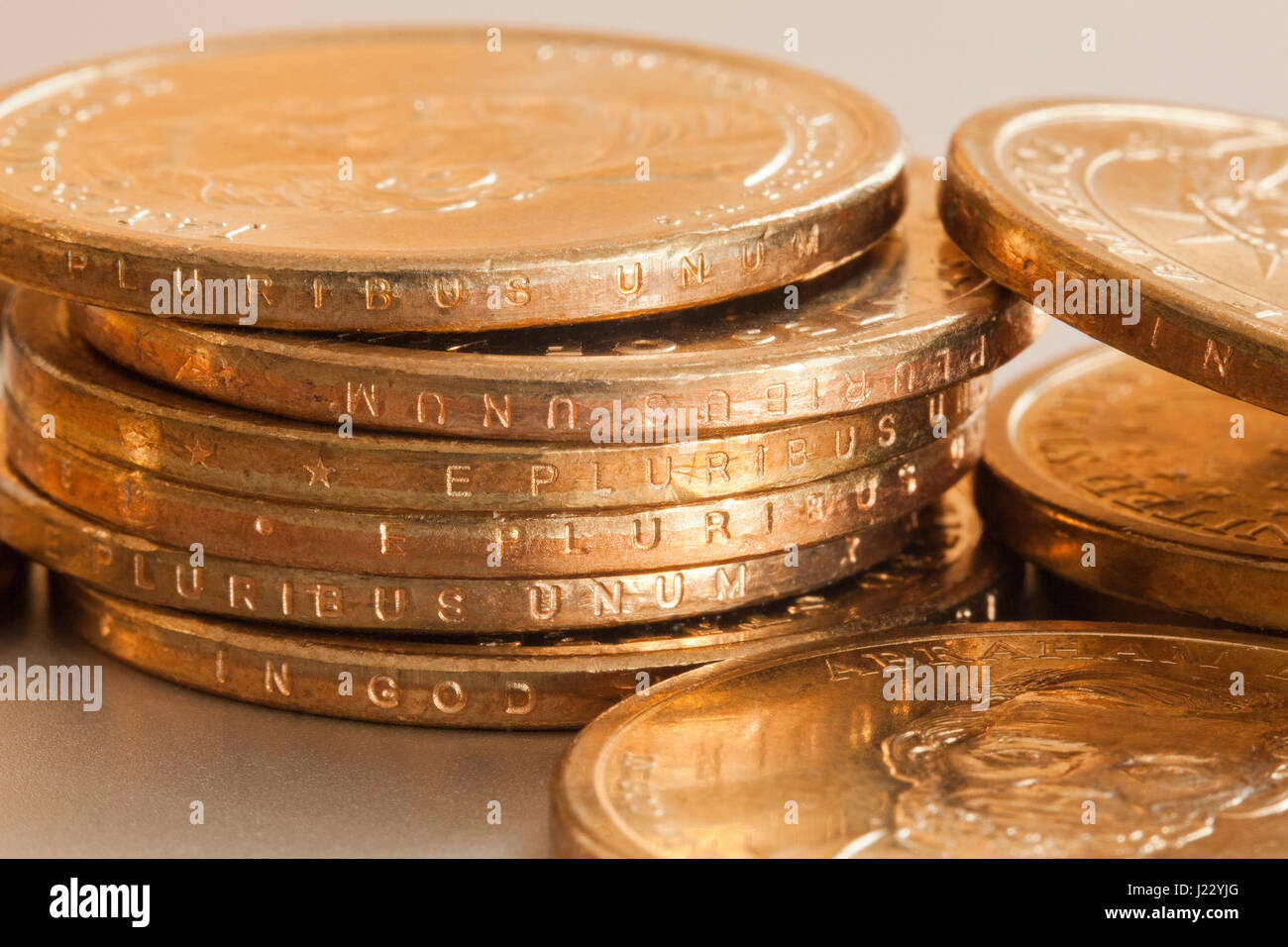 Presidential 1 dollar coin (US $1 coins edge view) - USA Stock Photo