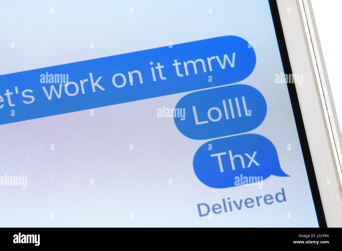 Text message on iPhone screen (LOL text message, common texting slang) -  USA Stock Photo - Alamy