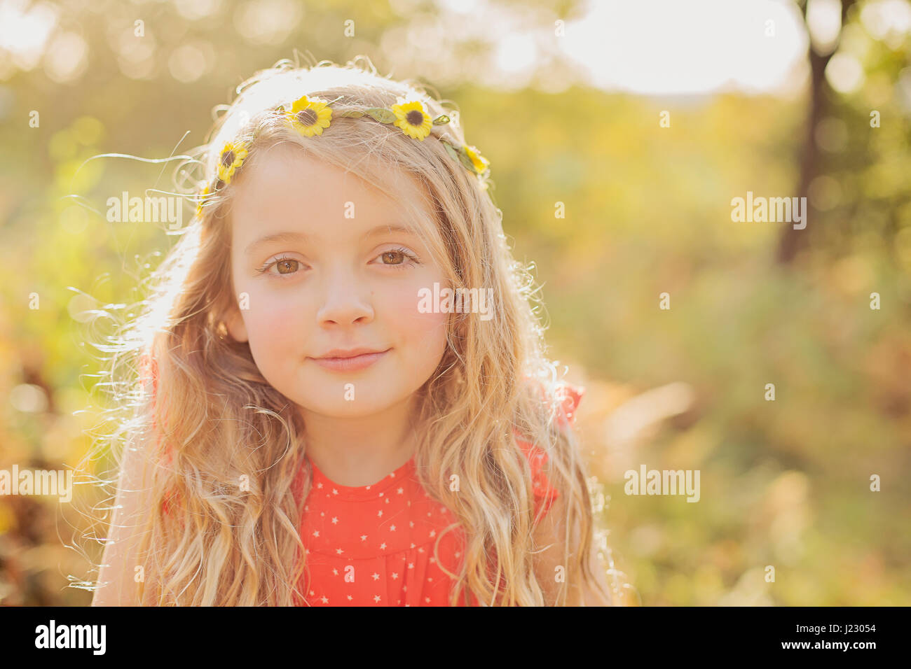Portrait of relaxed little girl wearing flower wreath Stock Photo
