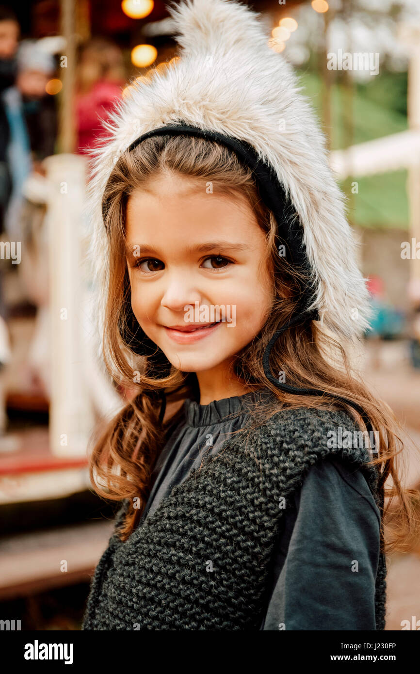 Portrait of smiling little girl wearing fur hat Stock Photo - Alamy