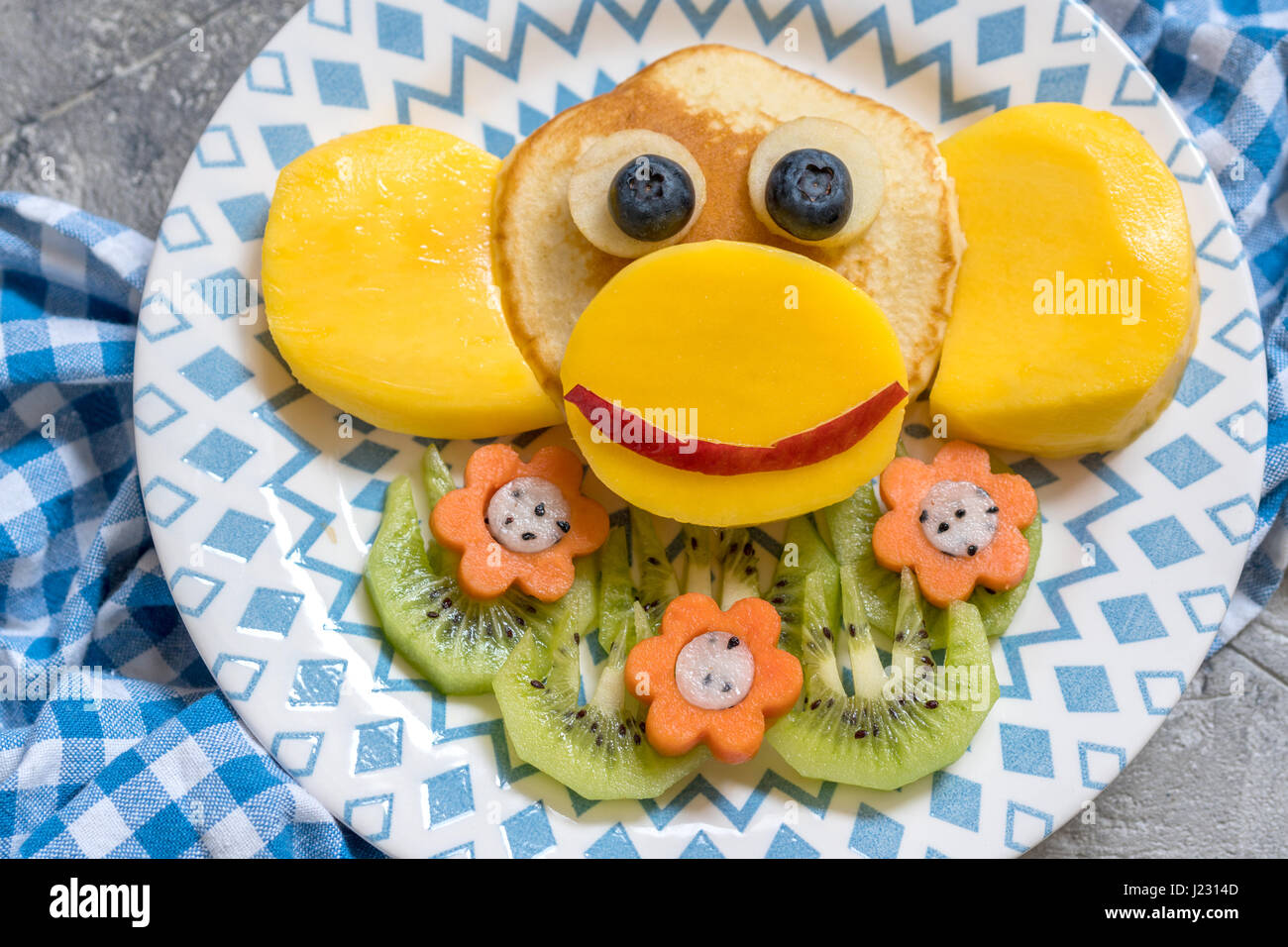 Funny monkey pancakes for kids breakfast Stock Photo