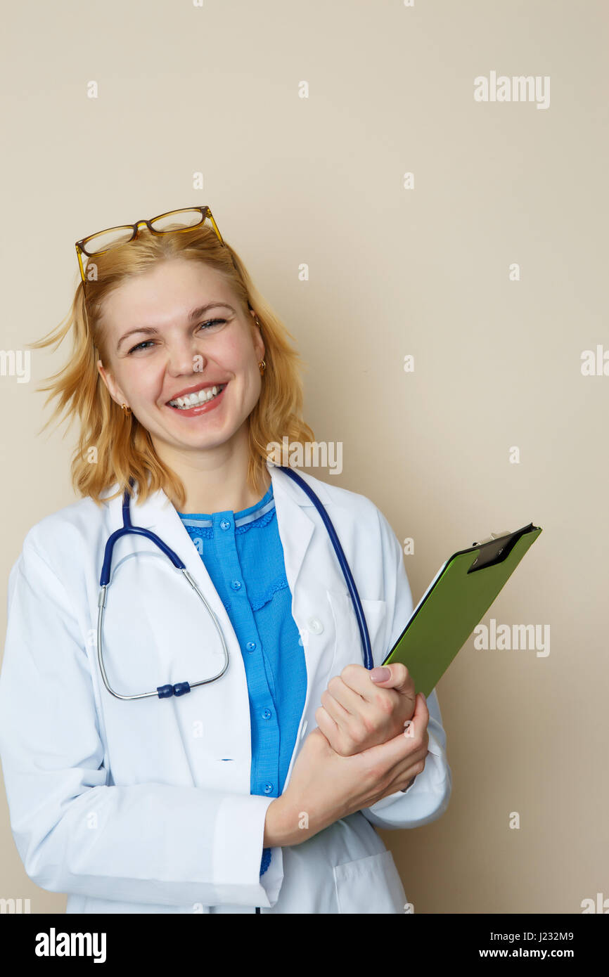 Blonde doctor with green folder Stock Photo