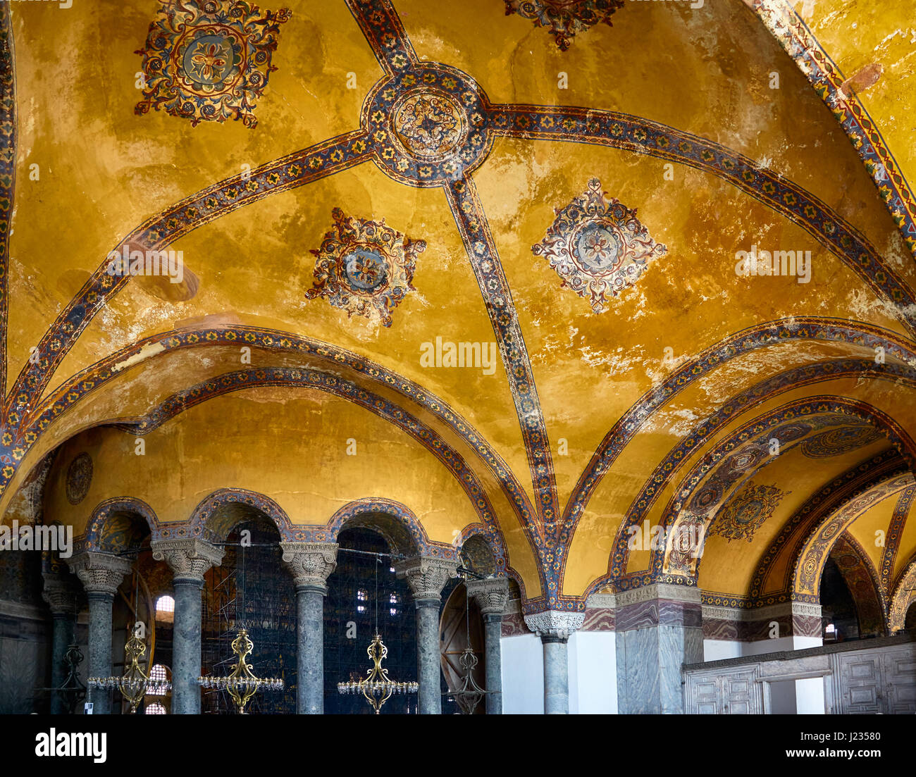 ISTANBUL, TURKEY - JULY 9, 2014: Ceiling mosaic decoration with original Christian cross in the Interior of the Hagia Sophia. Istanbul, Turkey Stock Photo