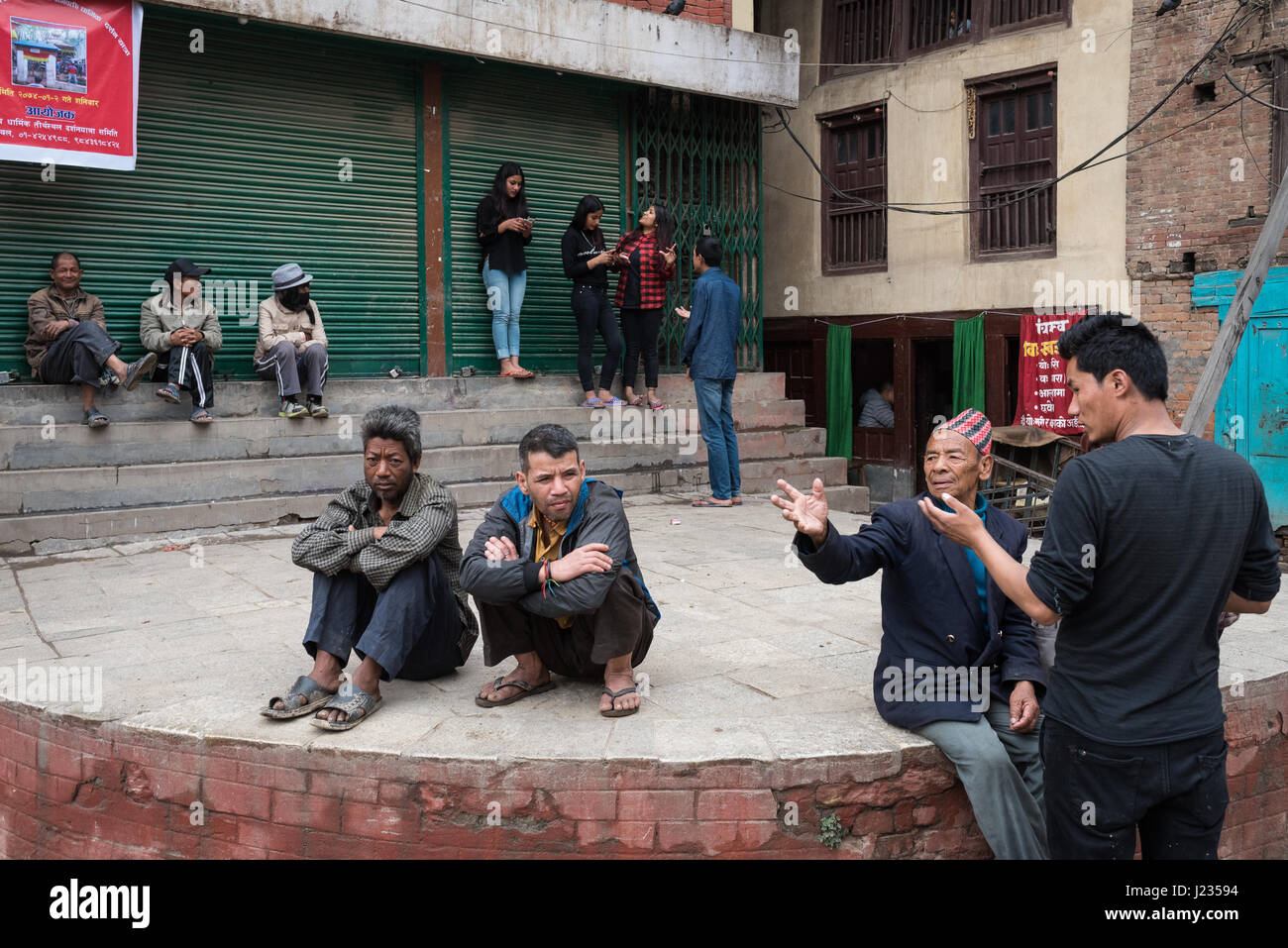 Man giving directions and other life on the street life in Kathmandu, Nepal. Stock Photo