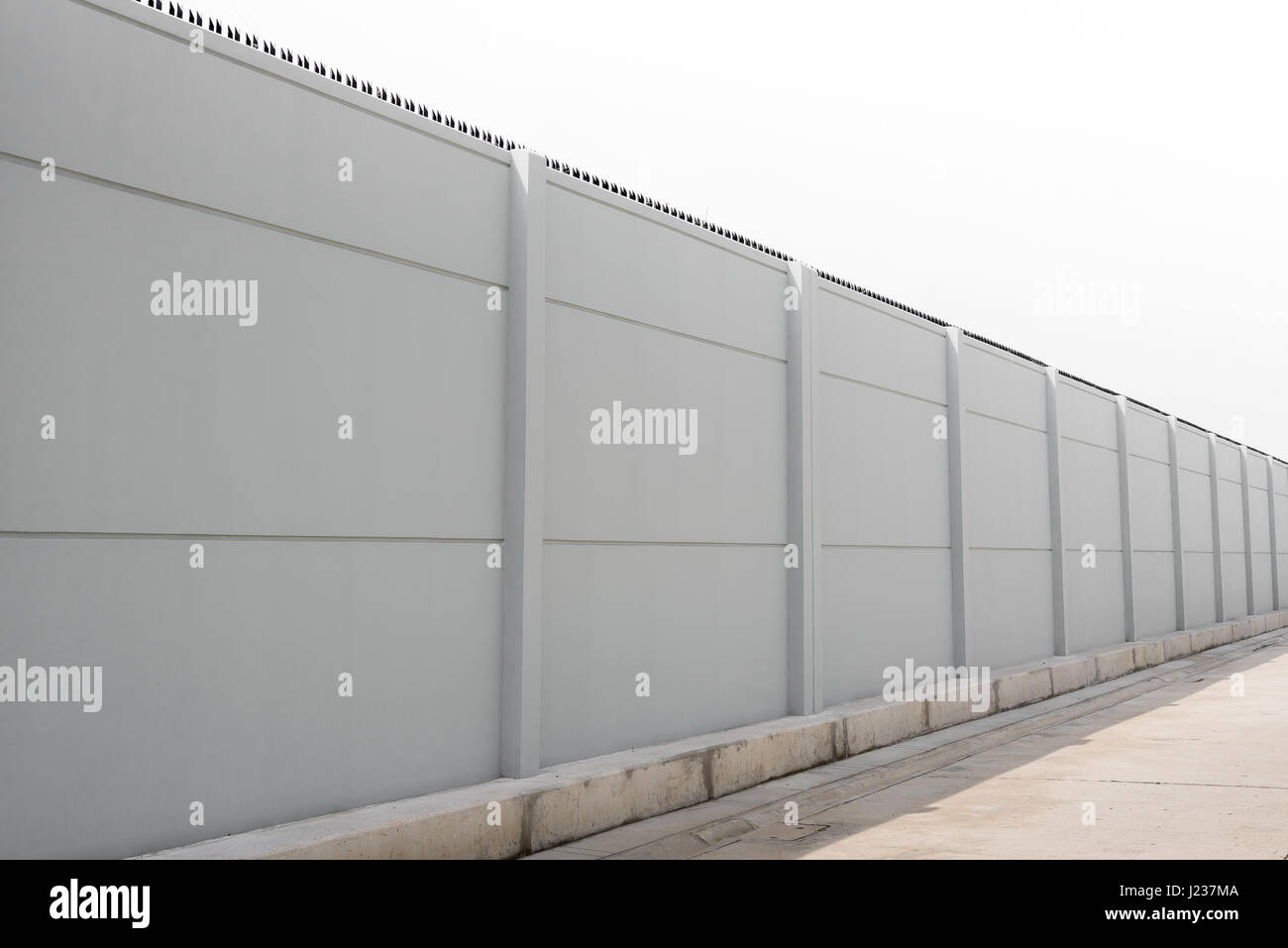 Prefabricated gray concrete fence isolated on white background Stock ...