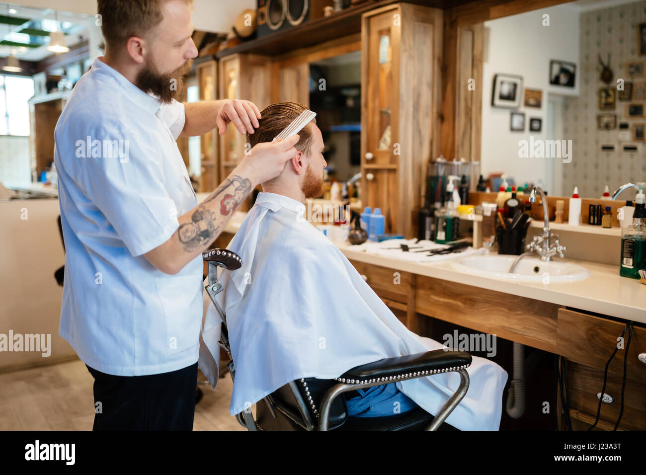 Hair mustache beard treatment in barber shop Stock Photo - Alamy