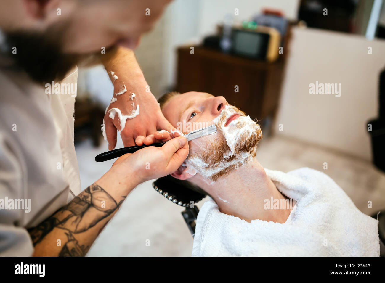 Retro shaving with foam in barber shop Stock Photo Alamy
