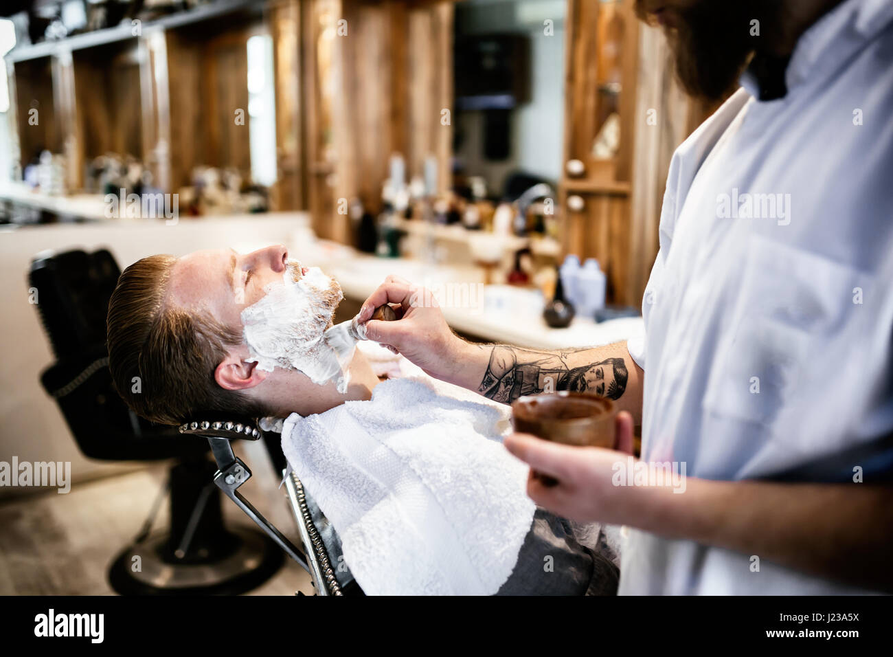 Retro shaving with foam in barber shop Stock Photo Alamy