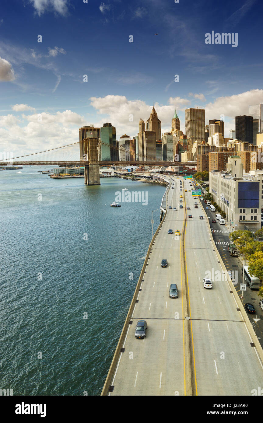 FDR Drive and Brooklyn Bridge at sunny day. Stock Photo