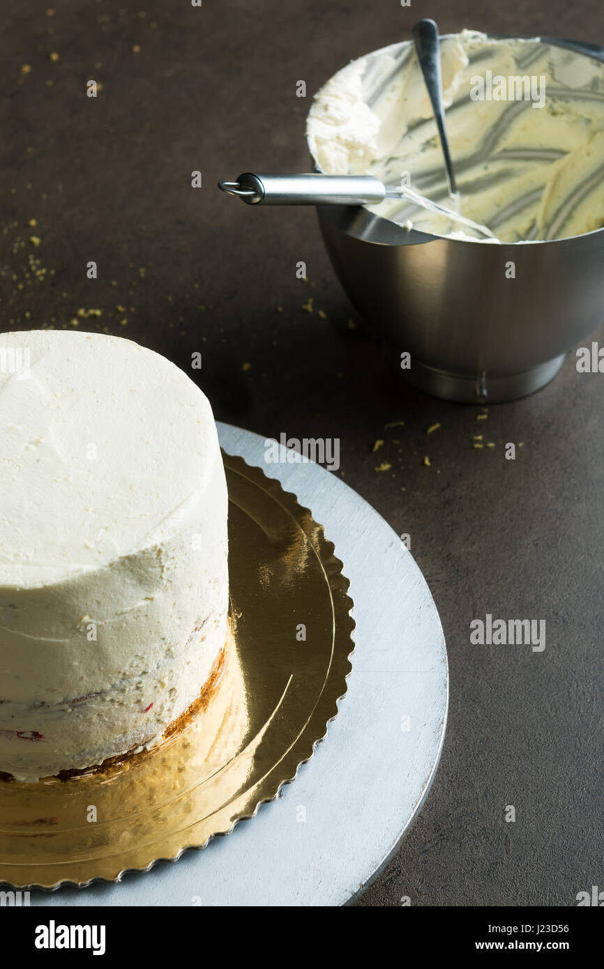 Delicious sponge cake filled with butter cream and decorated with frosting Stock Photo