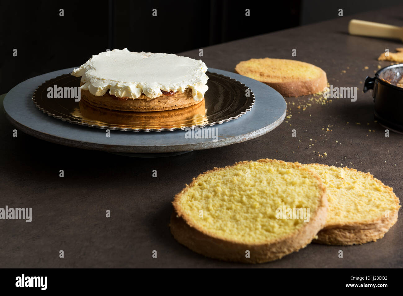Delicious sponge cake filled with butter cream and decorated with frosting Stock Photo