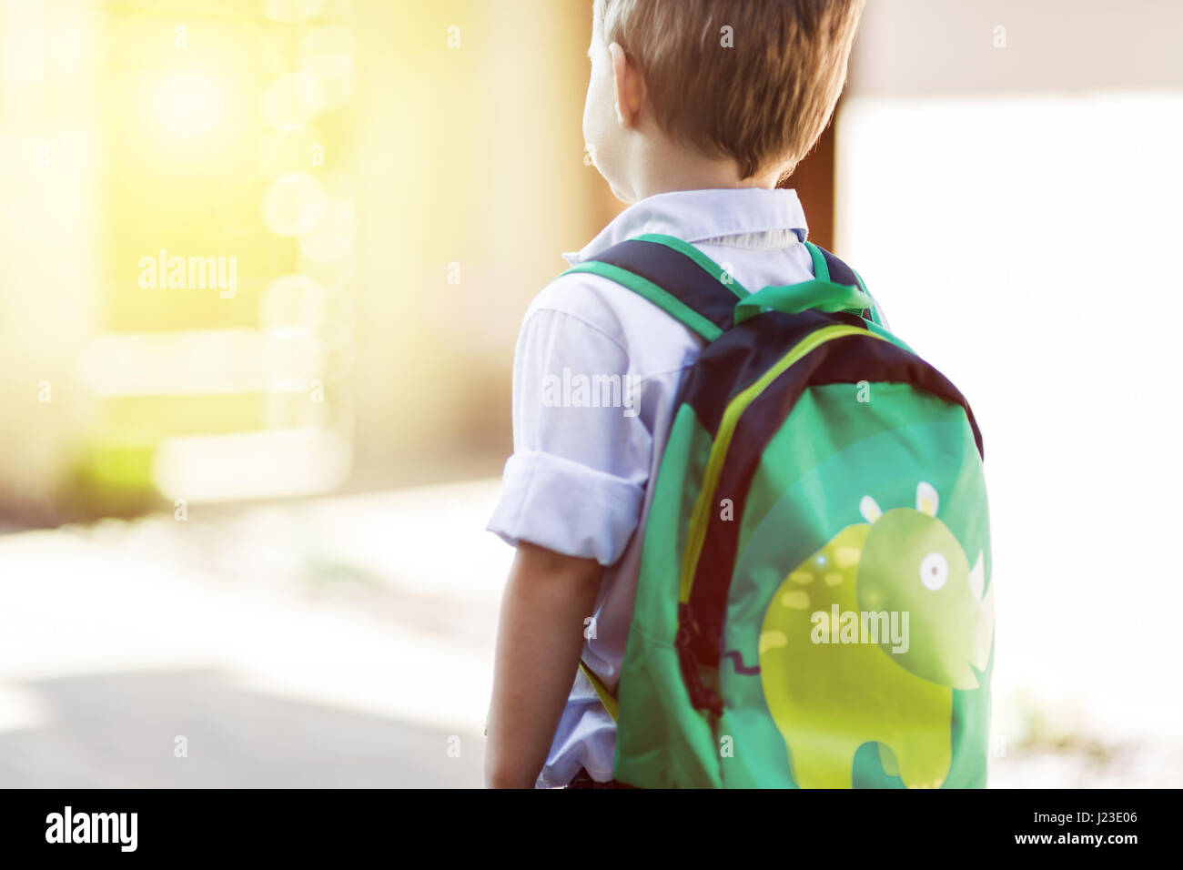 Child leaving home to his first day of kindergarten Stock Photo