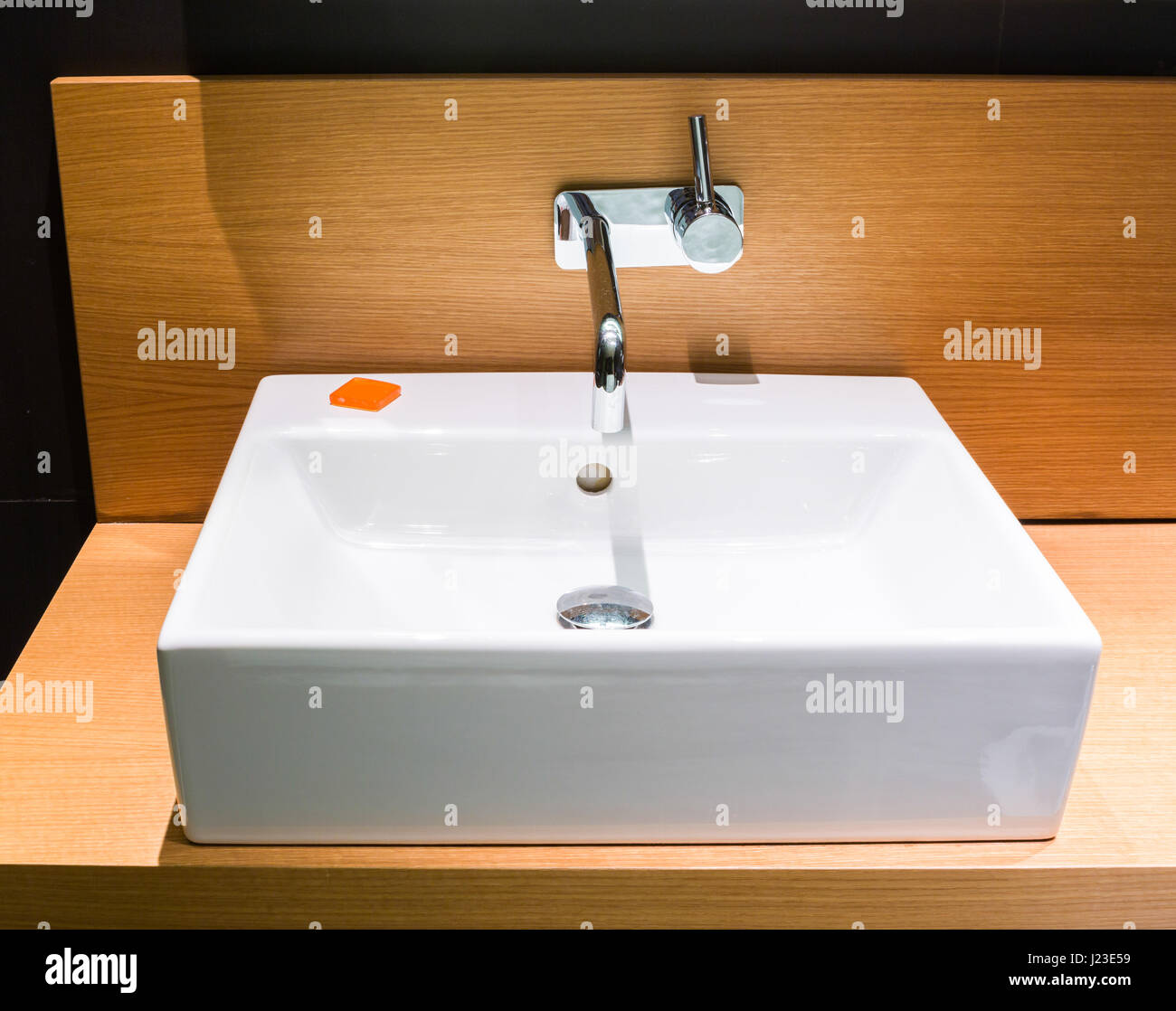 Modern bathroom sink - details of modern square ceramic sink washbasin Stock Photo