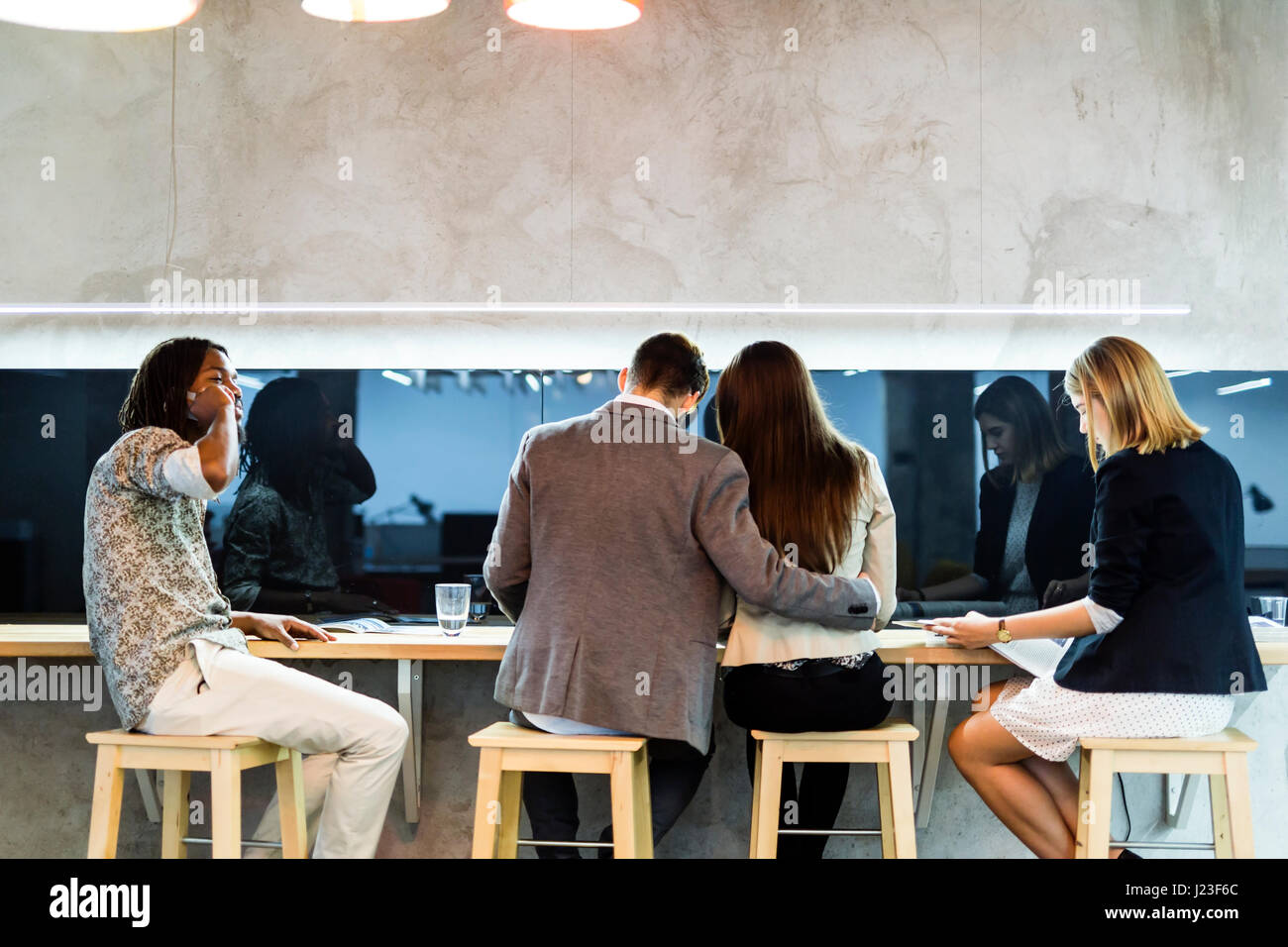 Group of people having a break from work in the cafeteria Stock Photo