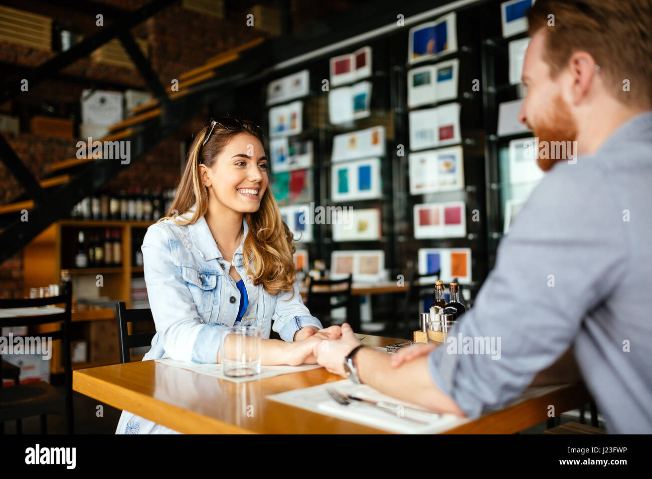 Couple dating in restaurant and enjoying each other's company Stock Photo