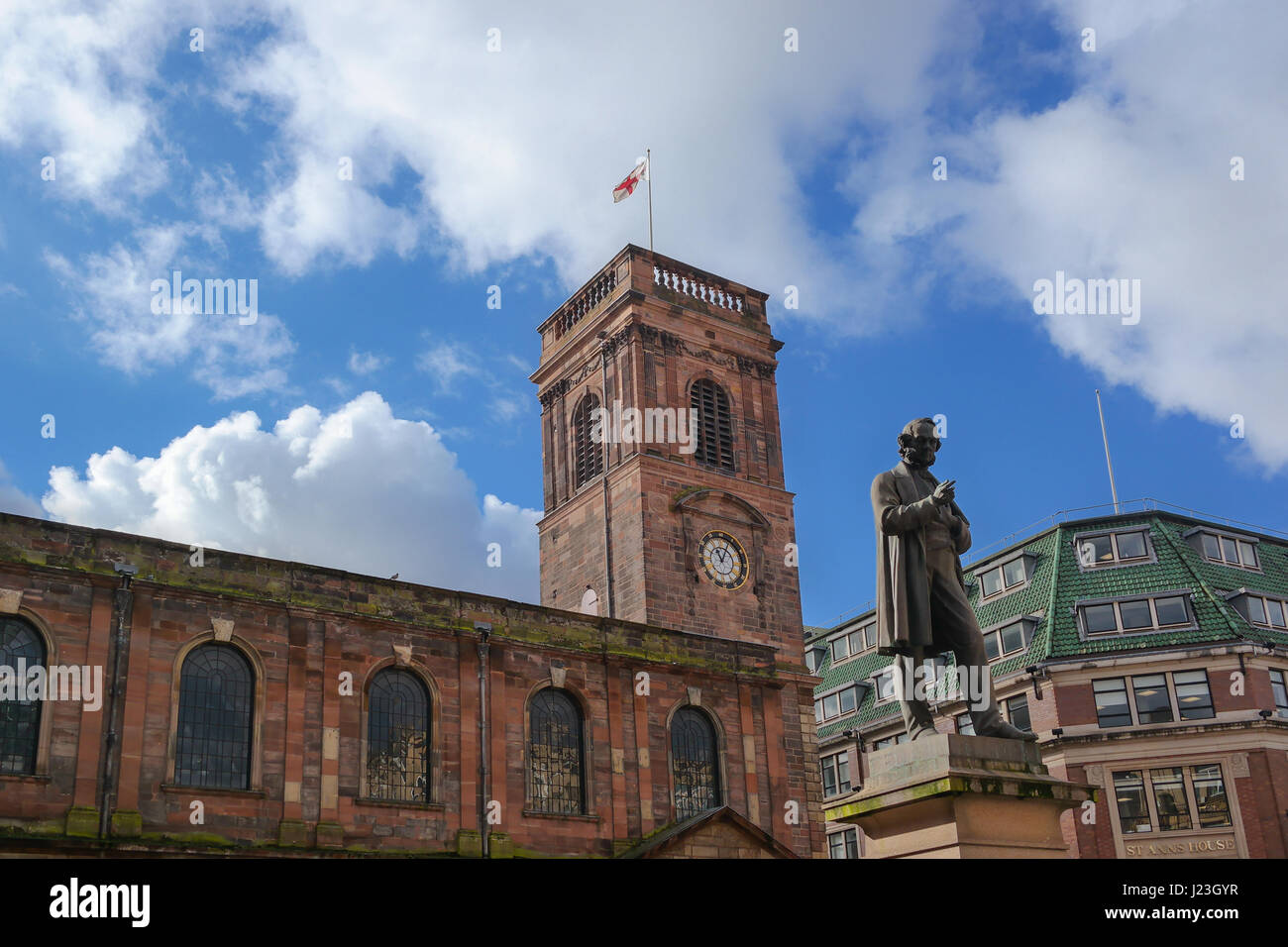 Exterior view of the Saint Ann's Church in Manchester, UK. View of the St. Ann's square and the statute Stock Photo