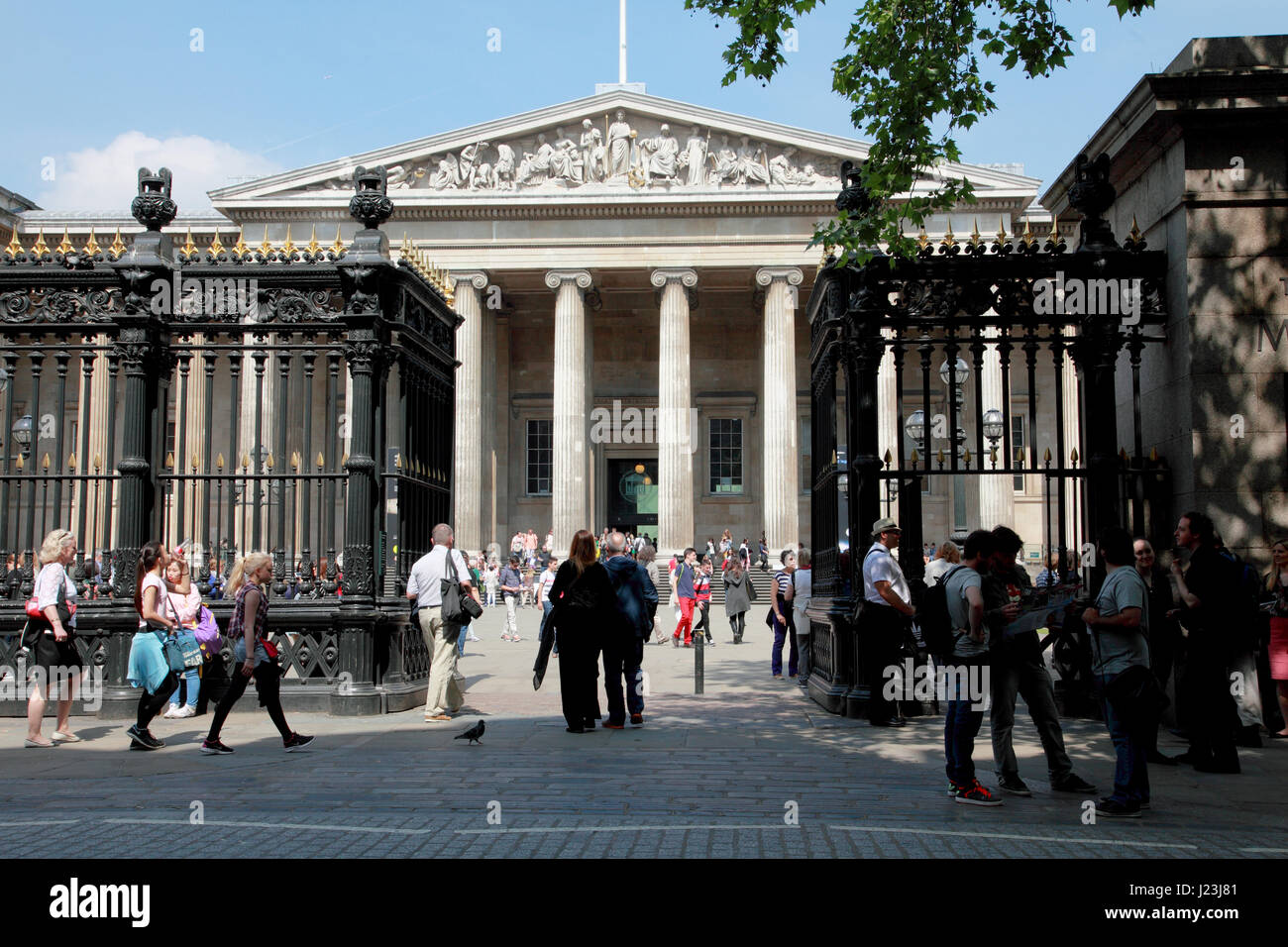 Tourists in and around the forecourt of the British Museum in London Stock Photo