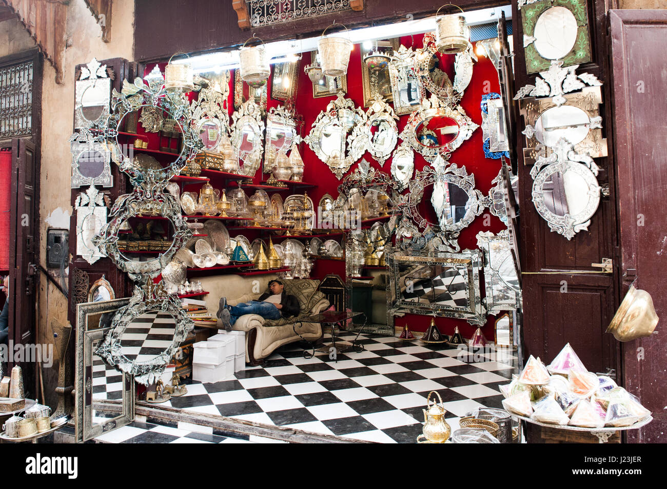 North Africa, Morocco, Fez, Medina. Craft shop, the employee is taking