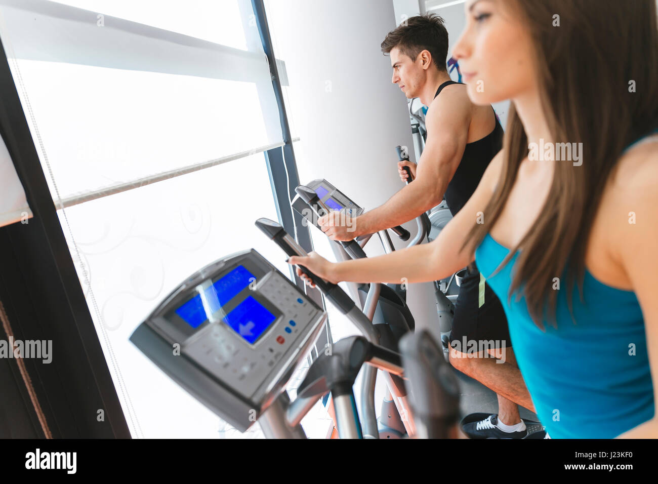 People exercising in gym to keep body in shape Stock Photo