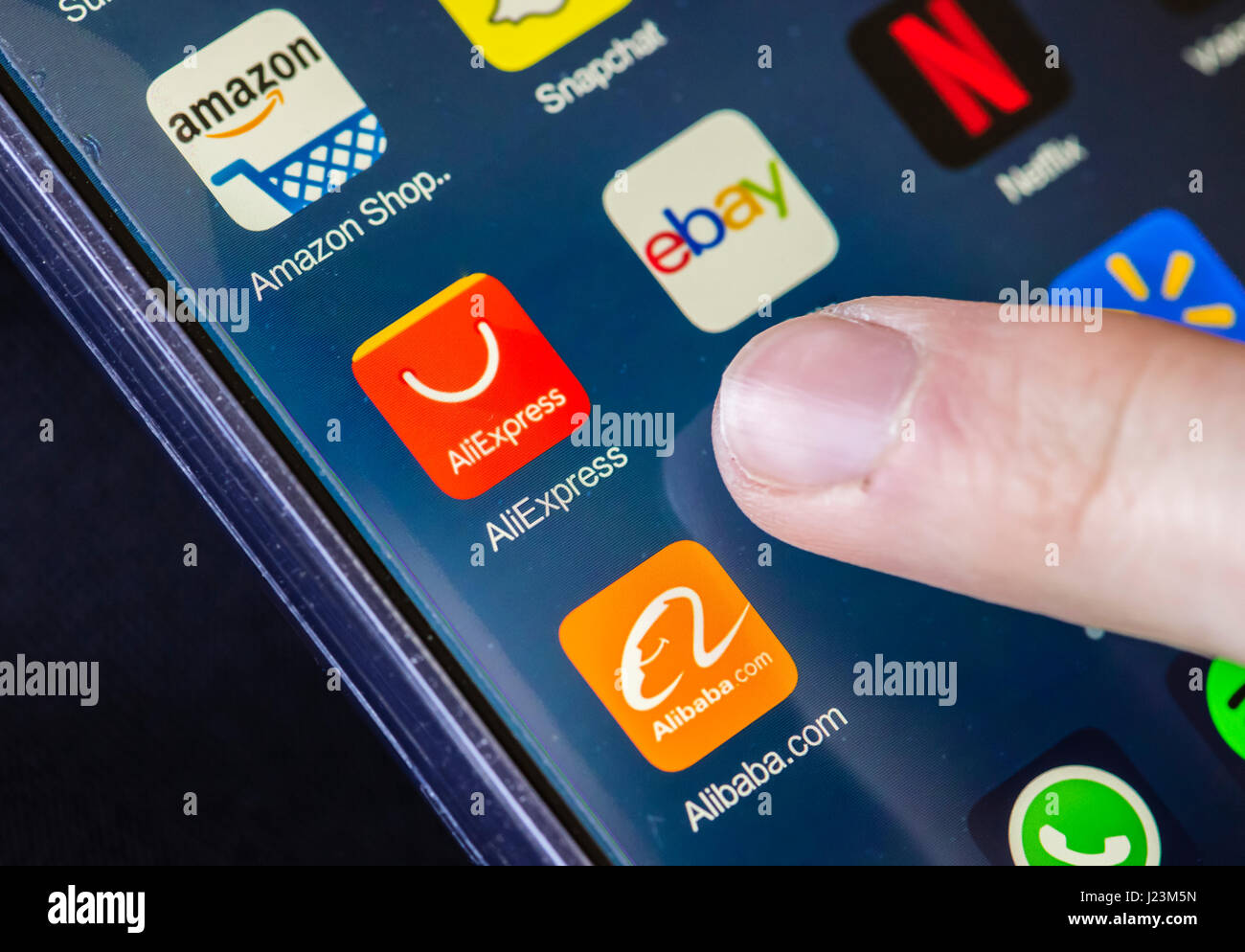Zurich, Switzerland - 19 February 2017: The icons of AliExpress, Alibaba.com, Ebay and Amazon online shopping apps on a smartphone's touchscreen. Stock Photo