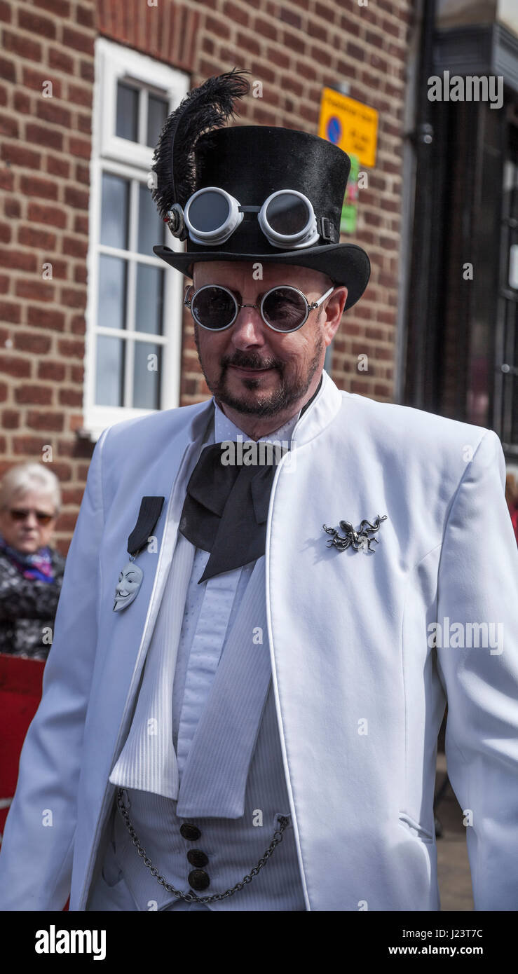 A man dressed in a white suit and black top hat at the Whitby Goth celebrations in North Yorkshire,England,UK Stock Photo