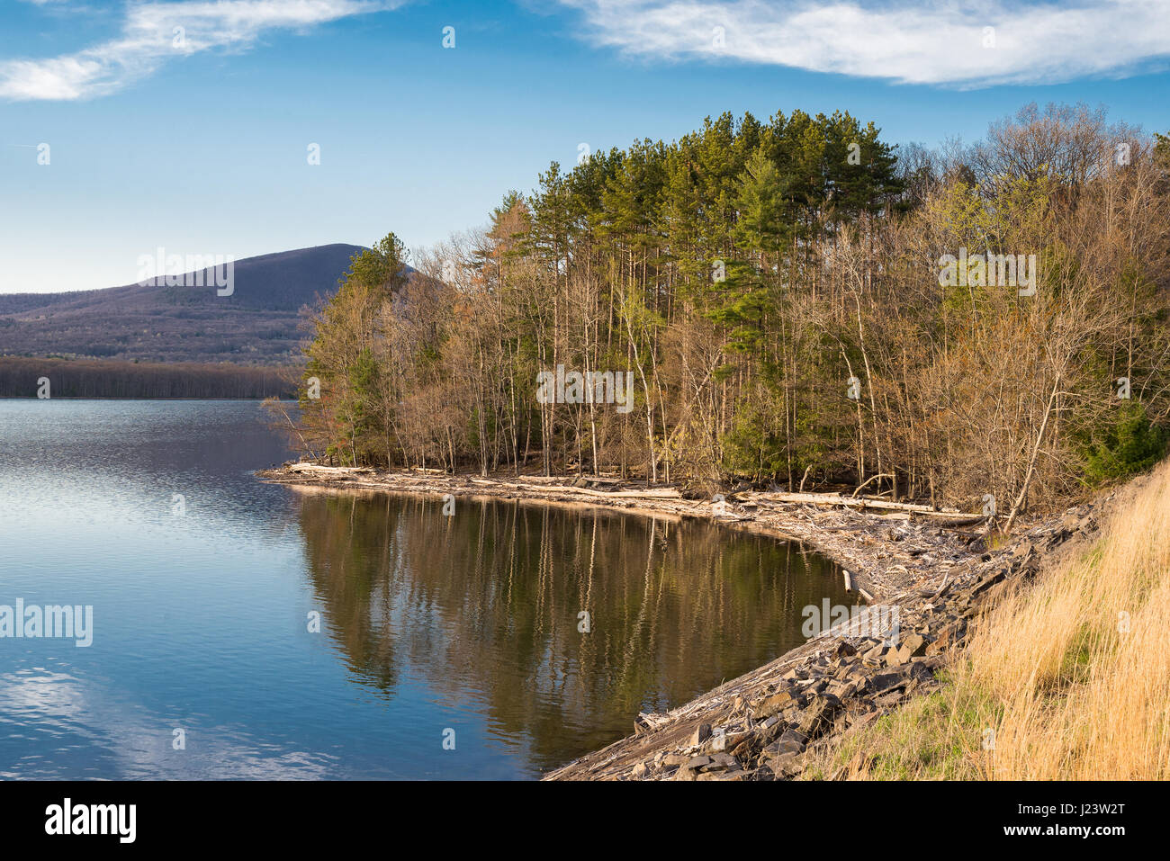 Shoreline of the Ashokan Reservoir at golden hour in the Catskill Mountains of the Hudson Valley of New York,a part the New York City water supply. Stock Photo