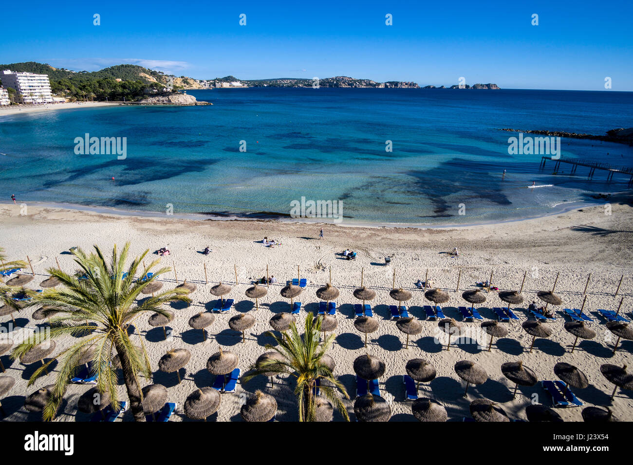 Part of the bay of Peguera with beach and some sun shades Stock Photo