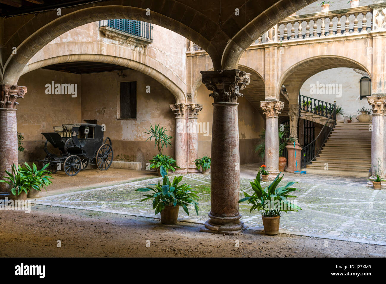 Architecture with arches and pillars in the courtyard of a local house