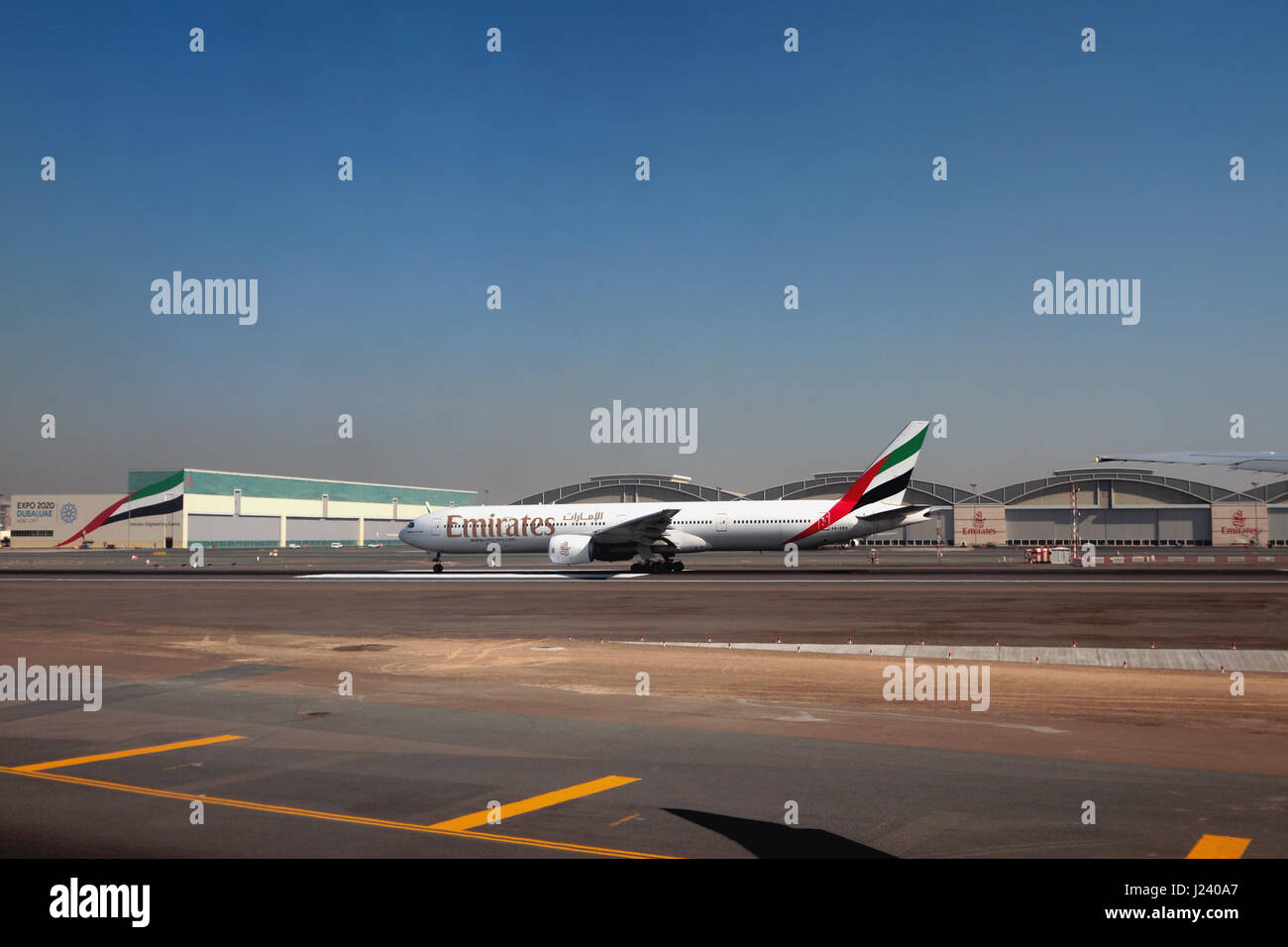 Plane of Emirates company A6-EMX, Boeing 777 at airport. Dubai, UAE Stock Photo