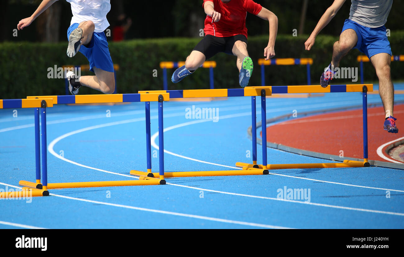 Boy running hurdles hires stock photography and images Alamy
