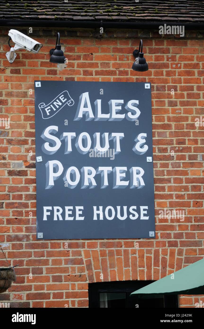 The Cricketers Inn, Sarratt, Hertfordshire,has a wonderful sign depicting a Batsman being bowled out with the cricket ball, bails, and a stump flying  Stock Photo